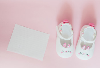 Childrens shoes for girls, stands on a pink background. closeup view from the top. the concept of children's clothing. Copyspace included.