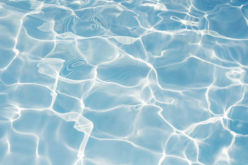 Texture of water in swimming pool for background