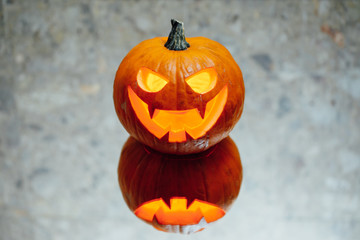 jack-o-lantern pumpkin candle light, gray background