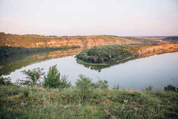 landscape meandering channel rocks canyons green vegetation