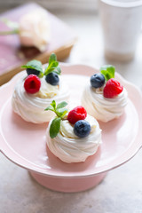 Anna Pavlova dessert with fresh berries. Meringue. Close-up.