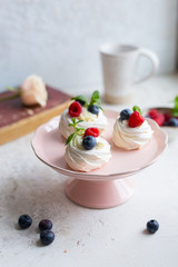 Anna Pavlova dessert with fresh berries. Meringue. Close up. Food photo.