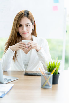 smart and attractive charming business asian woman ready to work with energy and happiness morning light on office