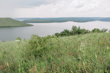 landscape meandering channel rocks canyons green vegetation