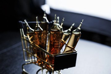 Many brown ampoules set in cart