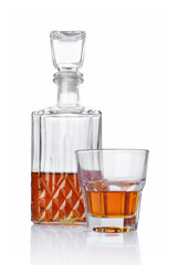 Strong alcoholic drink cognac in old fashion glass and crystal decanter