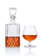 Strong alcoholic drink cognac in sniffer glass and crystal decanter