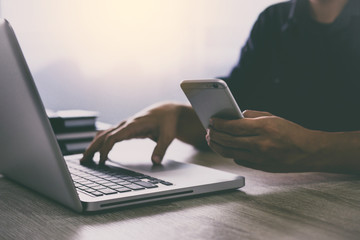 Man typing laptop and using smartphone for online shopping and pay by credit card, Online payment and shopping concept
