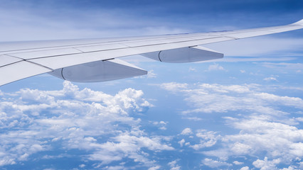 Wing of airplane fly over blue sky 3