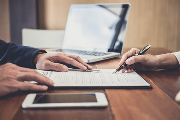 Sales manager filing keys to customer after signing rental lease contract of sale purchase agreement, concerning mortgage loan offer for and house insurance