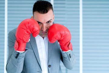 strong smart manager ready to fight in business competitive man wera punch glove in action