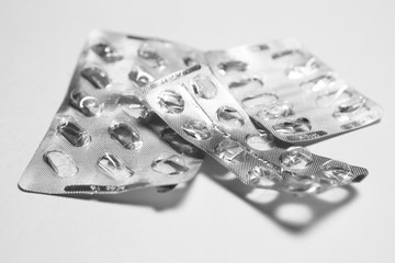 Many empty used packs of pills