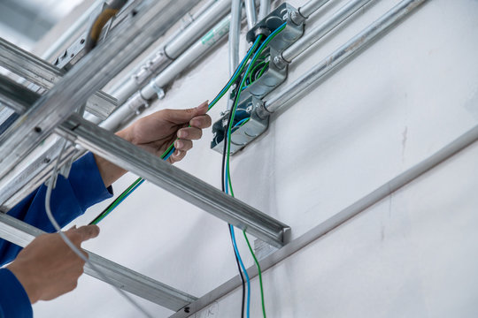 eletrical wiring work workmen do wiring tube site construction concept