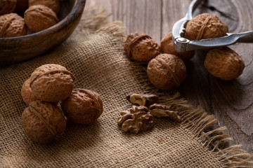Walnuts kernels in wooden bowl, Walnut healthy food Top view