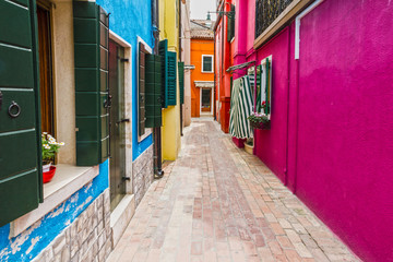 Fototapeta na wymiar Venice, Burano narrow street multicolor houses, Italy