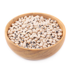 Black-eyed peas in a wooden bowl isolated on a white background