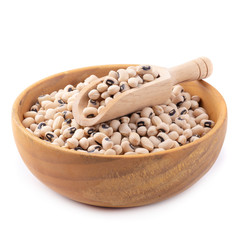 Black-eyed peas in a wooden bowl isolated on a white background