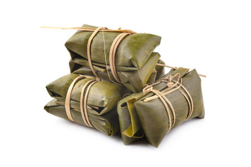 Thai dessert style which insert banana and black Peas inside to sticky rice isolated on white...