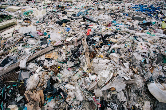 pile of garbage ; garbage dump . Waste from household in waste landfill