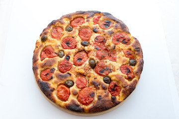 Focaccia typical of Bari Italy with tomatoes and olive