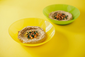 Colorful hummus bowls. Traditional hummus. Horizontal top view. Vegetarian dish.