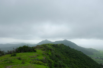 Fototapeta premium Lush green monsoon nature landscape mountains, hills, Purandar, Maharashtra, India