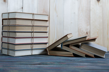 Education and reading concept - group of colorful books on the wooden table