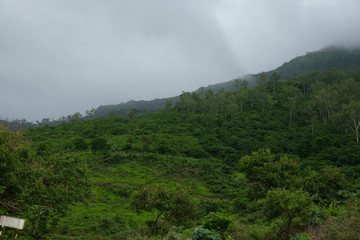 Fototapeta na wymiar Lush green monsoon nature landscape mountains, hills, Purandar, Maharashtra, India