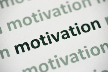 Fototapeta premium word motivation printed on paper macro