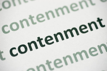 word contenment printed on paper macro