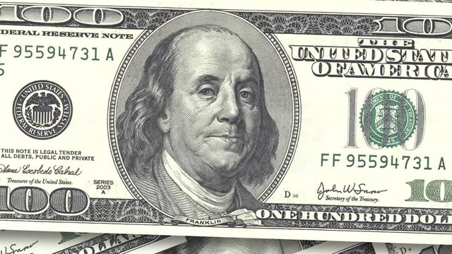 Background with money American bills. Cash money background. fast rotation of paper dollars close-up