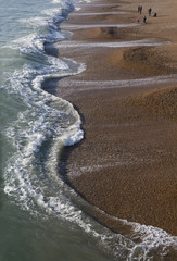 Fototapeta na wymiar scallop edged waves at Brighton beach