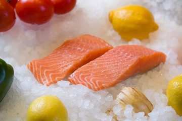 Fresh salmon fillet on ice.