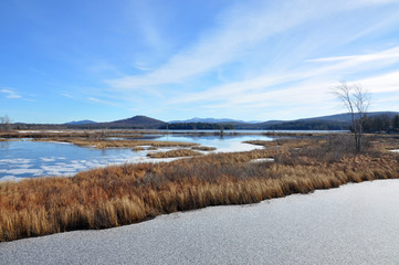 Tupper Lake in winter with snow in town of Tupper Lake, Adrondack Mountains, New York, USA.