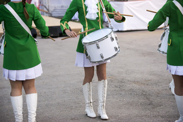 girls marching with drums