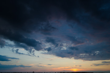 Fototapeta premium Clouds in the light of sunset.