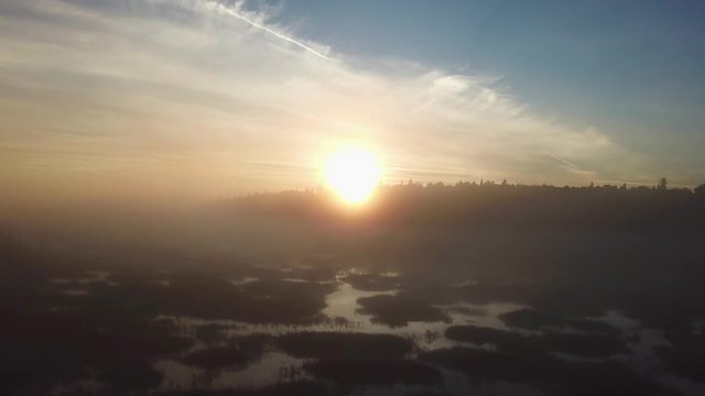 Beautiful foggy sunrise over the Kenai River flats at 5am in Alaska.
