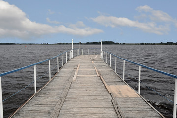 Naklejka premium Boat pier on the river Sheksna