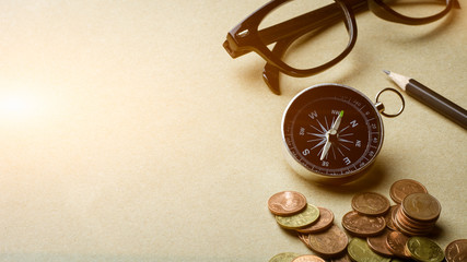 compass on brown paper background.