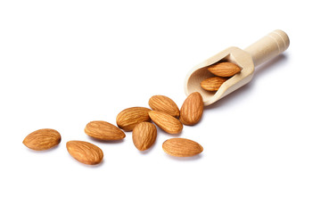 Almonds and a wooden scoop, isolated on white background