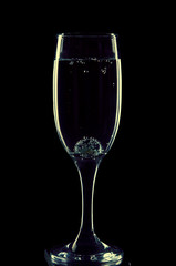 A glass for champagne with a glass ball and bubbles in retro style