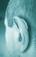 Hearing aid in ear of man