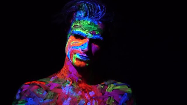 Halloween, Smiling Man in neon Colors, Painted Body, Modern Art