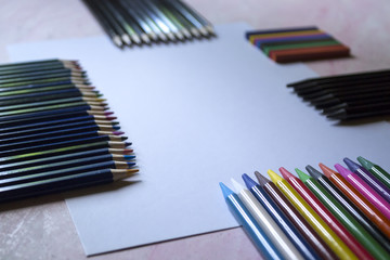 Fototapeta premium The set of pencils and white paper on the table.