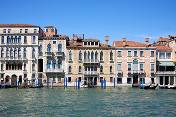 Fototapeta na wymiar Venice ancient buildings facades and the grand canal in a sunny day in Italy