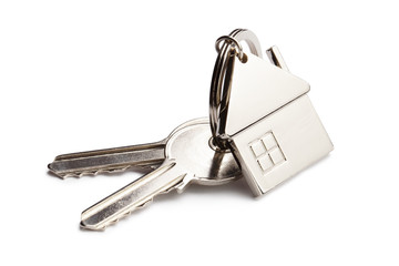 House keys with house shaped keychain, isolated on white background