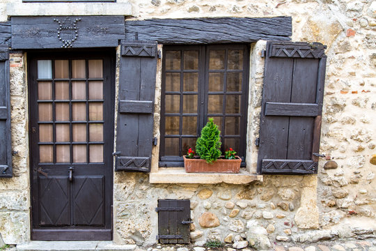Hanging Shutters and Timbered Door in the Ancient Village of Perouges, France