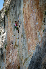 Woman rock climbing in Siurana