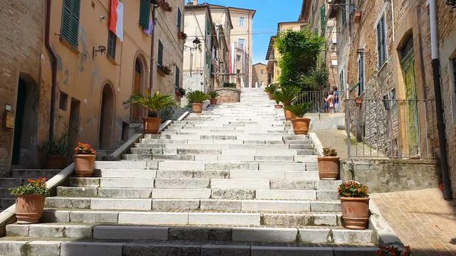A folkloristic stairs rich of plants and flowers in Corinaldo's medieval center