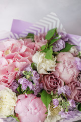 beautiful spring bouquet. flower arrangement with hydrangea and peonies. Color lilac. The concept of a flower shop, a small family business